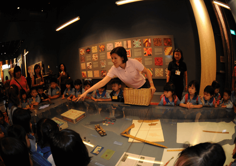 image of Angeline hosting a programme in National Museum of Singapore.